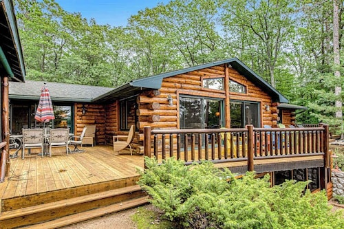 Lakefront log cabin on 3.5 acres with dock, gazebo & sunset views - dog-friendly