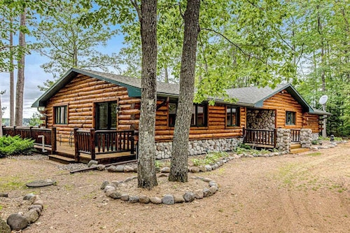 Lakefront log cabin on 3.5 acres with dock, gazebo & sunset views - dog-friendly