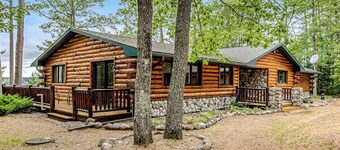 Lakefront log cabin on 3.5 acres with dock, gazebo & sunset views - dog-friendly