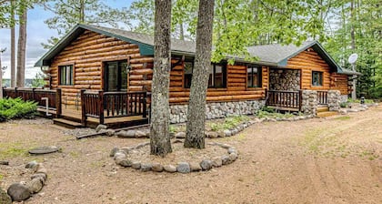 Lakefront log cabin on 3.5 acres with dock, gazebo & sunset views - dog-friendly