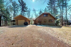 Exterior - Charming Northwoods Riverfront home, w/ chain access, fire pit, gas grill & WIFI (Eagle River)