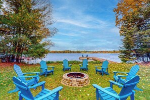 Property grounds - Lakefront home with yard, private dock, deck, firepit, & washer/dryer (Eagle River)