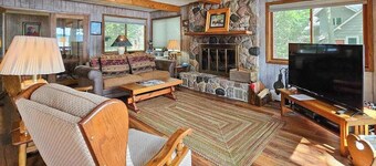 Waterfront home between 2 lakes w/ heated porch, dock & kayaks
