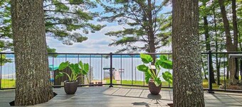 Waterfront home between 2 lakes w/ heated porch, dock & kayaks