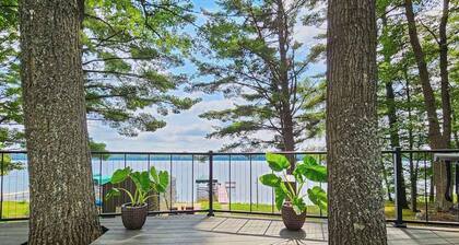 Waterfront home between 2 lakes w/ heated porch, dock & kayaks
