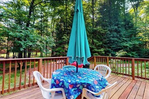Outdoor dining - Serene Lakefront Home w/ dock, gas grill, fire pit, WIFI, on ATV trail (Eagle River)
