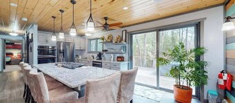 Cozy Wooded home with WIFI, Gas Grill, Two Kitchens, Near Lakes & Trails