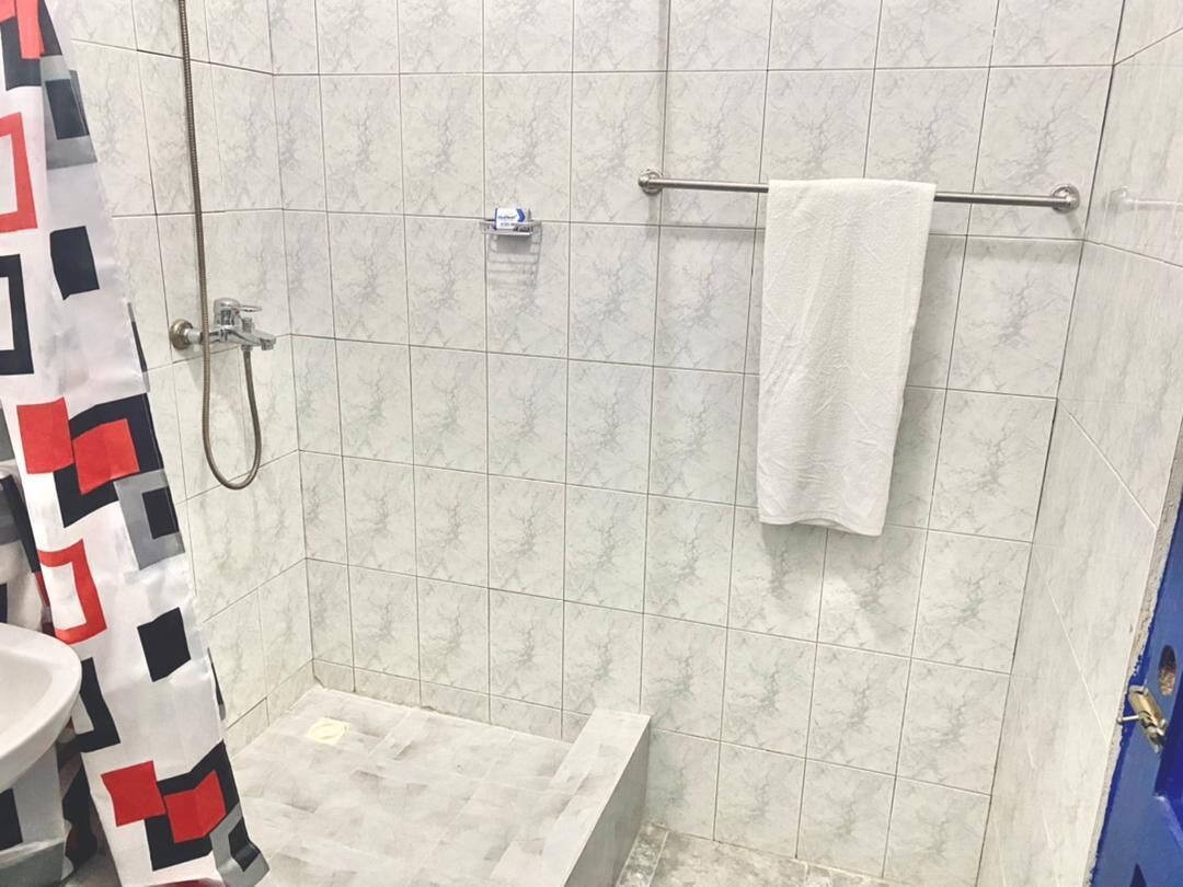 Shower, towels, soap, toilet paper