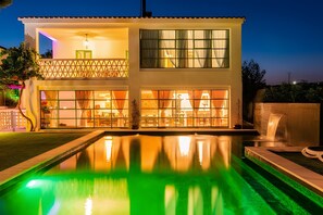 A two-story building with a swimming pool in front. - La Espada Rural Villa: Country House for Groups in Castilla (Valdeporro)