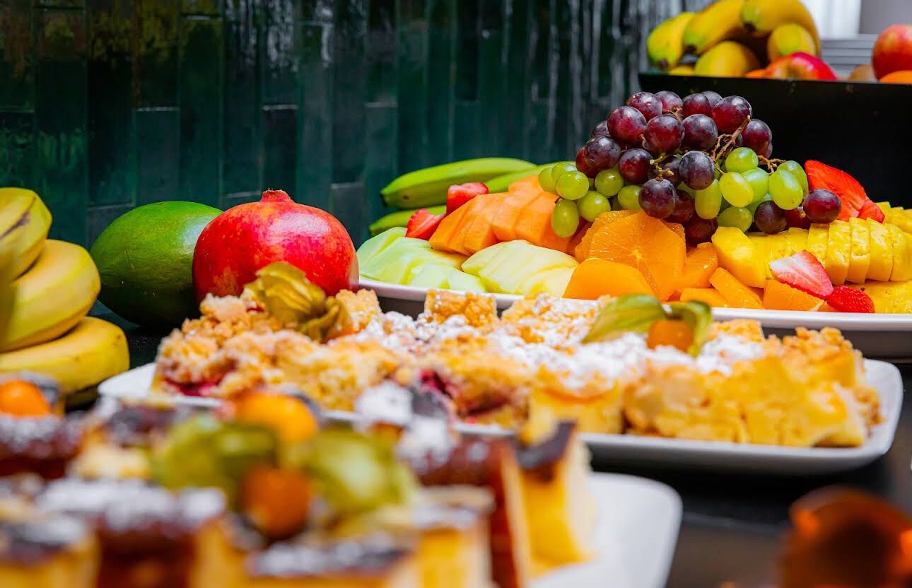 A variety of fruits and desserts on display.