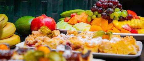 A variety of fruits and desserts on display.