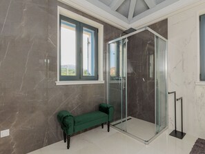 A modern bathroom with a glass shower enclosure, a bench, and a view through the window. - Seafront Villa Adriatica with pool by Interhome (Pašman/Neviđane)