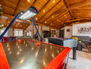 A spacious indoor area with a foosball table, a pool table, and a billiards table. - Vacation home  by Interhome (Donje Rastane)