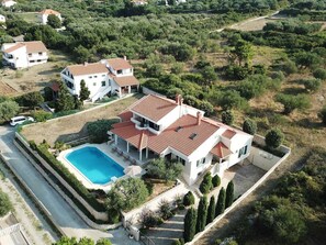 A large villa with a swimming pool, surrounded by lush greenery and other residential properties. - Magnificent Villa Clara with big pool by Interhome (Petrčane)