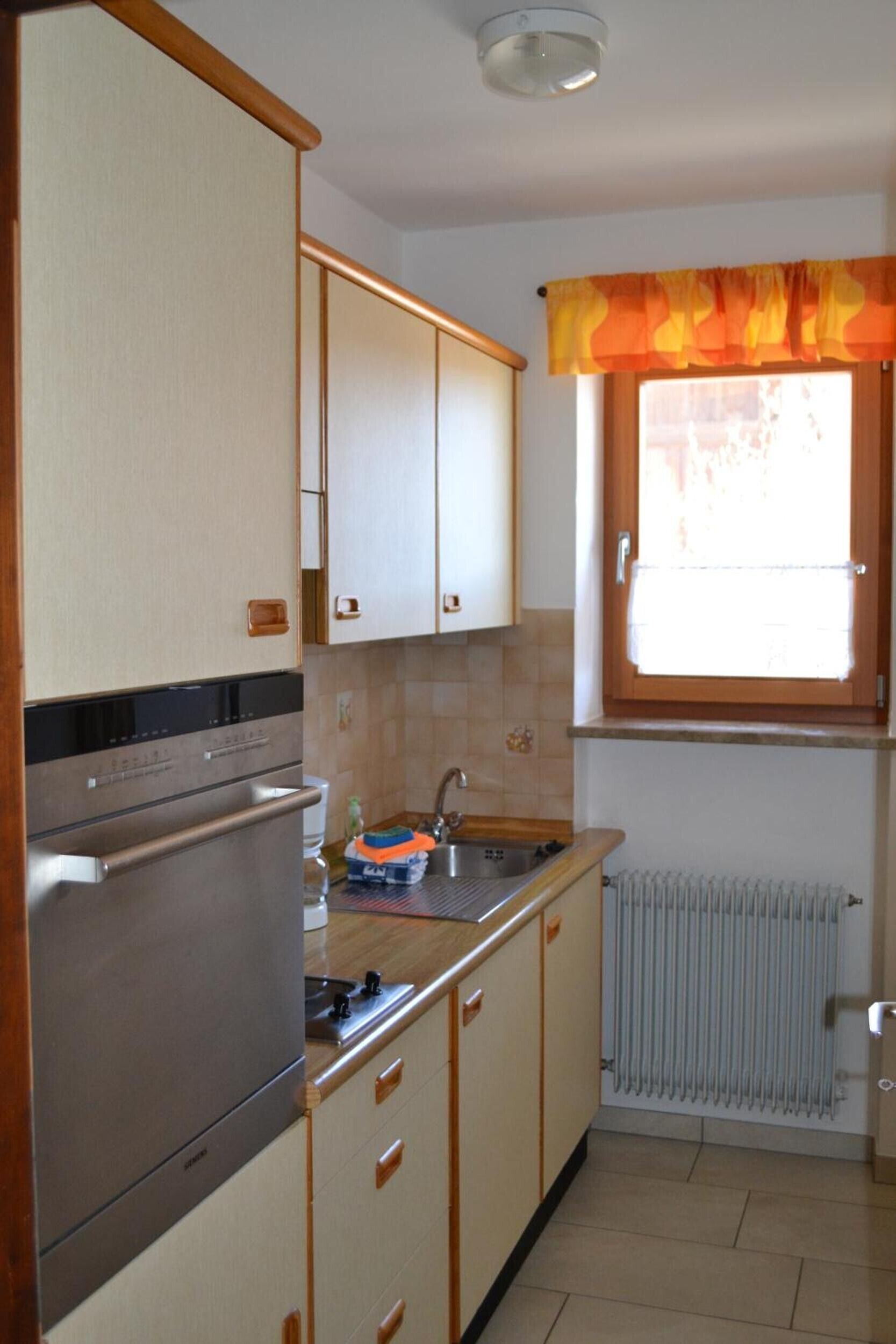 Fridge, stovetop, dishwasher, coffee/tea maker