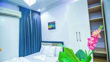 Family Room, Balcony, City View | In-room safe, desk, laptop workspace, blackout drapes