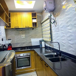 Family Room, Balcony, City View | Private kitchen - Jay's Wood Hotel And Apartment (Benin City)