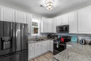 Fridge, oven, stovetop, coffee/tea maker