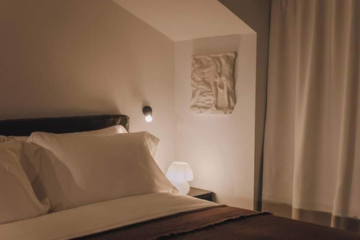 Deluxe Studio | Premium bedding, laptop workspace, blackout drapes, soundproofing