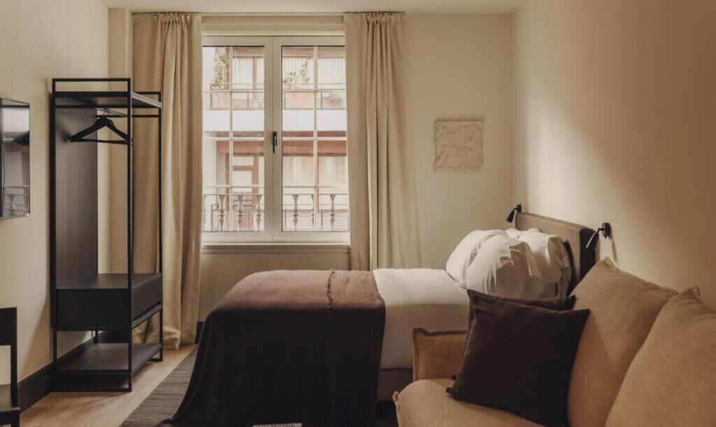 Studio | Premium bedding, laptop workspace, blackout curtains, soundproofing