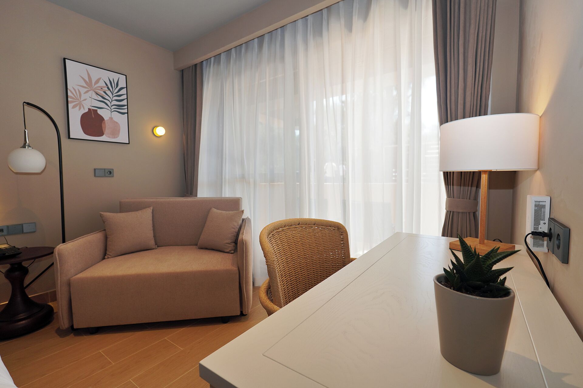 Ionian Two - Spaces Suite Garden View | Minibar, in-room safe, laptop workspace, iron/ironing board