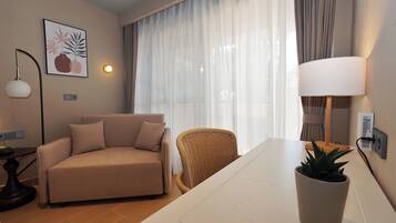 Ionian Two - Spaces Suite Garden View | Minibar, in-room safe, laptop workspace, iron/ironing board