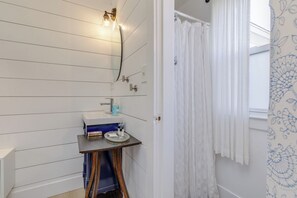 Shower, hair dryer, towels, toilet paper