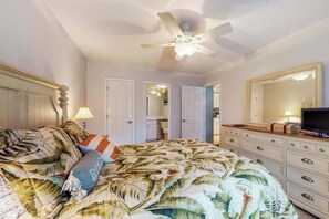 A bedroom with a bed, a ceiling fan, a dresser, and a television. - Sea Colony Condo with Pools, Tennis, Beach Access, WiFi, Central AC, and W/D (Bethany Beach)