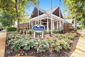 A building with a sign reading 'The Pavilion' and a date '1 October Glory'. - Bear Trap Dunes home with fabulous shared amenities, jetted tub, & bikes (Ocean View)