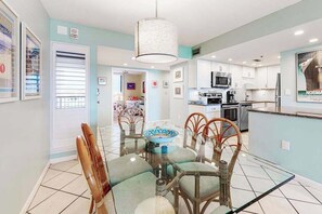 A modern kitchen with white cabinets, a microwave, and a refrigerator. - Sea Colony Oceanside Condo W/Free WiFi, Shared Pool, & Private Washer/Dryer (Bethany Beach)