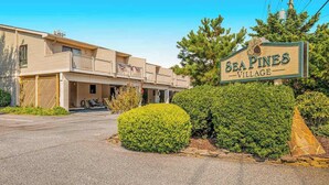 A two-story building with a sign reading 'Sea Pines Village.' - Sea Pines Townhouse Steps From the Water w/Free WiFi, Shared Pool, Private W/D, AC (Bethany Beach)