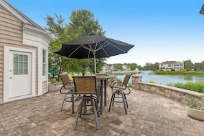 Outdoor dining - Bethany Lakes home with waterfront views, pool access, tennis, & private patio (Bethany Beach)