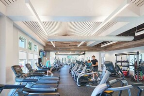 A gym with treadmills, stationary bikes, and weight machines. - Bayside Resort home with paid-access pools & other resort amenities (Selbyville)