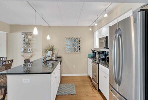Fridge, microwave, oven, stovetop - Town of Dewey Beach condo with marina views, pool, balcony (Dewey Beach)