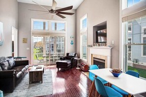 TV, fireplace, offices - Bayside Resort townhome with deck, balcony, pools, & hot tub (Selbyville)