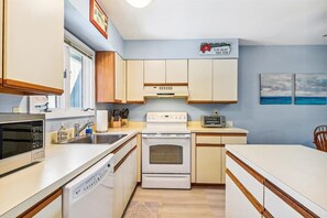 Fridge, microwave, oven, stovetop - Updated Sea Colony condo with pools, hot tubs, lake views, & high-speed WiFi (Bethany Beach)