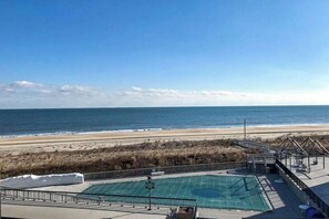 A pool area with a view of the beach and ocean. - Entire condo in Bethany Beach, Delaware (Bethany Beach)