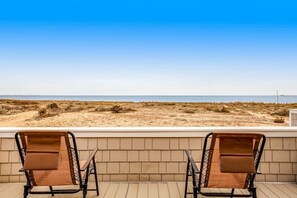 Two lounge chairs facing a beach with a clear sky. - Dog-friendly oceanfront escape at Lewes with fast WiFi & AC - right on the beach (Lewes)