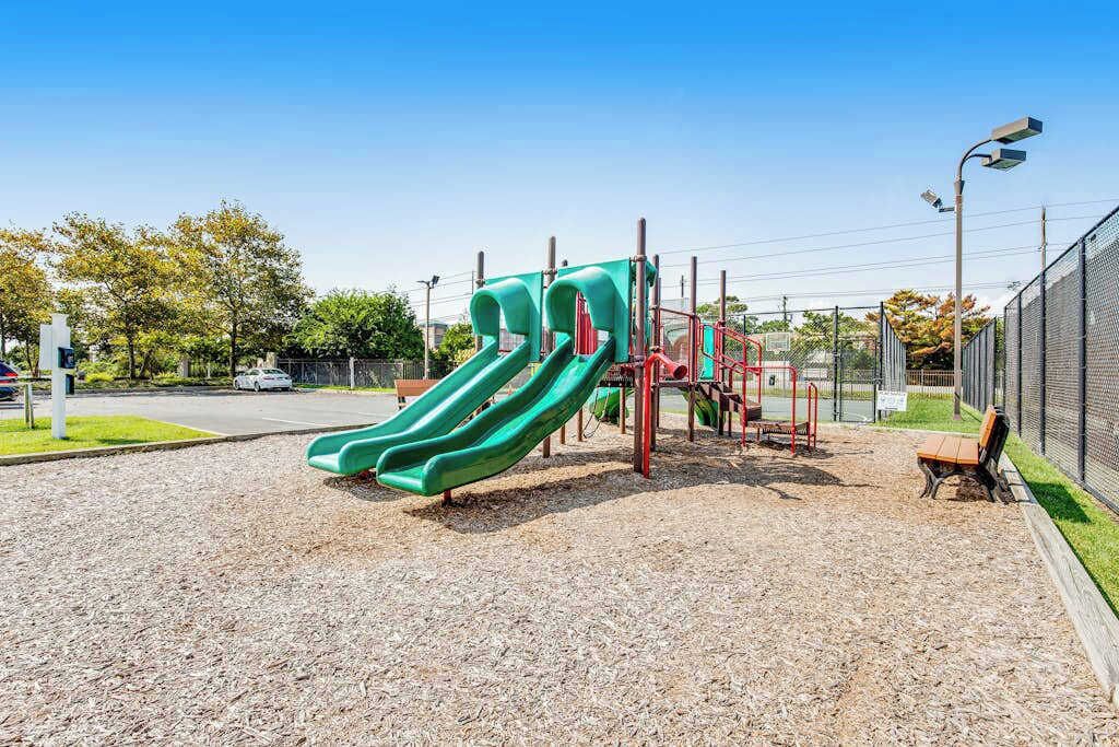 A playground with slides and climbing structures.