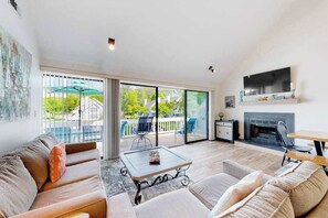 TV, fireplace, offices - Sea Colony West - Waterfront condo with pool, beach access, tennis, & W/D (Bethany Beach)