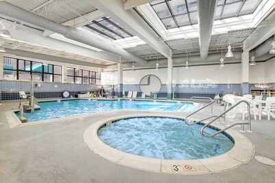 Sea Colony villa with deck, AC, multiple pools, hot tubs, gym, & sports courts
