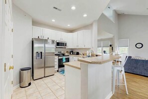 Fridge, microwave, oven, stovetop - Bear Trap Dunes dog friendly condo with pools, hot tub, WiFi, central A/C (Ocean View)