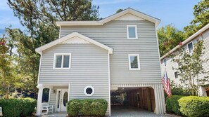 A two-story house with a garage, a front porch, and a small front yard. - Town of South Bethany house w/patio, grill, close to beach & restaurants (Bethany Beach)