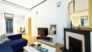 Departamento Confort, vista a la ciudad | Área de sala de estar
