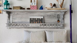 A rustic wooden shelf with decorative items, a thermometer, and framed photos. - Studio on La Corniche with Shared Pool, Private Terrace, and Shared Garden (Saint-Palais-sur-Mer)