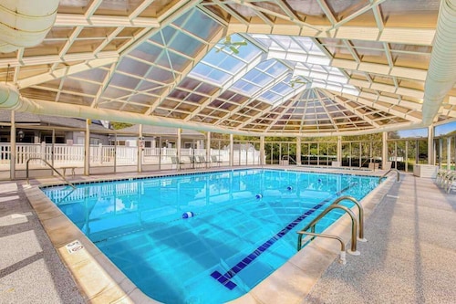 Salt Pond home with on-site golf, indoor/outdoor pools, gym, & sports courts