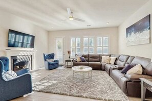 TV, fireplace, offices - Luxury Ocean View Beach Club home with fireplace, pool, sports courts, & gym (Ocean View)