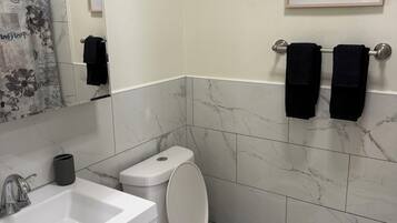 Hair dryer, towels, soap, toilet paper