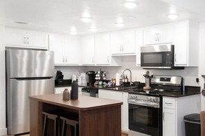 Fridge, microwave, oven, stovetop - Stylish Resort Creekfront 2BR Sleeps 6 w/ Patio, Gym, Indoor/Outdoor Pools (Branson)