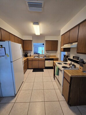 Private kitchen - Lovely 2-bedroom duplex with AC in charming Crystal Beach. (Palm Harbor)